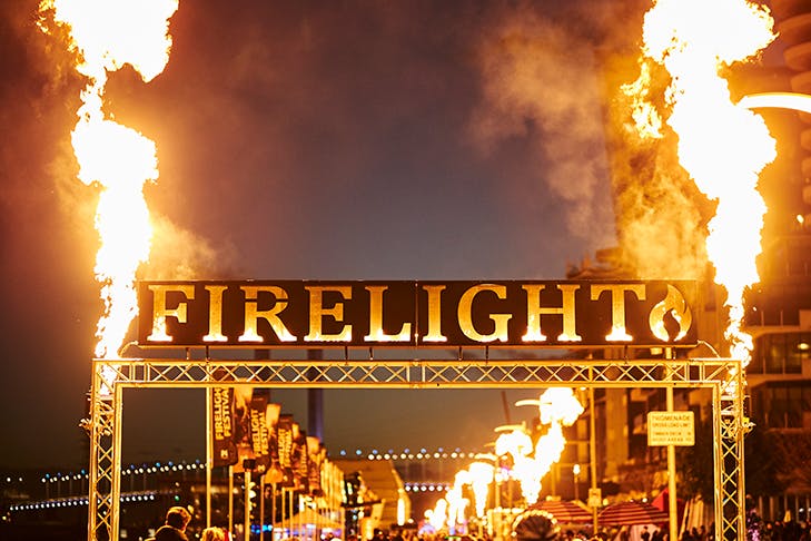 A sign that reads 'Firelight' with large flames erupting on both sides.
